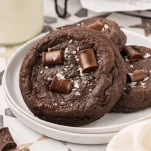 Fresh homemade double chocolate cookie in Lahore, topped with large chocolate pieces and sea salt flakes.