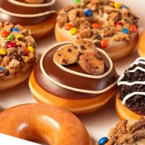 Homemade cookie & cream filled donuts topped with chocolate, cookies and colorful candies available for fresh delivery in Lahore.