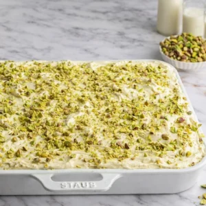 Homemade pistachio cream bliss topped with crushed nuts available for delivery in Lahore.