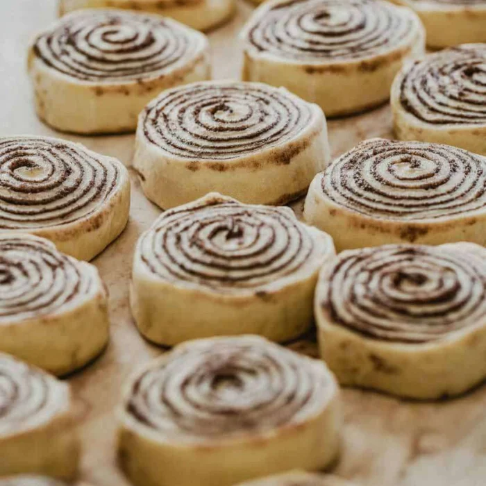 Freshly baked homemade cinnamon rolls in Lahore with rich chocolate swirl and soft fluffy texture ready for baking.