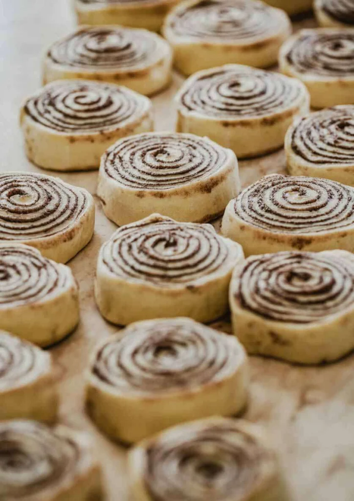 Freshly baked homemade cinnamon rolls in Lahore with rich chocolate swirl and soft fluffy texture ready for baking.