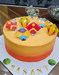 Custom Basant theme cake with colorful kite design available for order in Lahore.