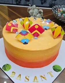 Custom Basant theme cake with colorful kite design available for order in Lahore.